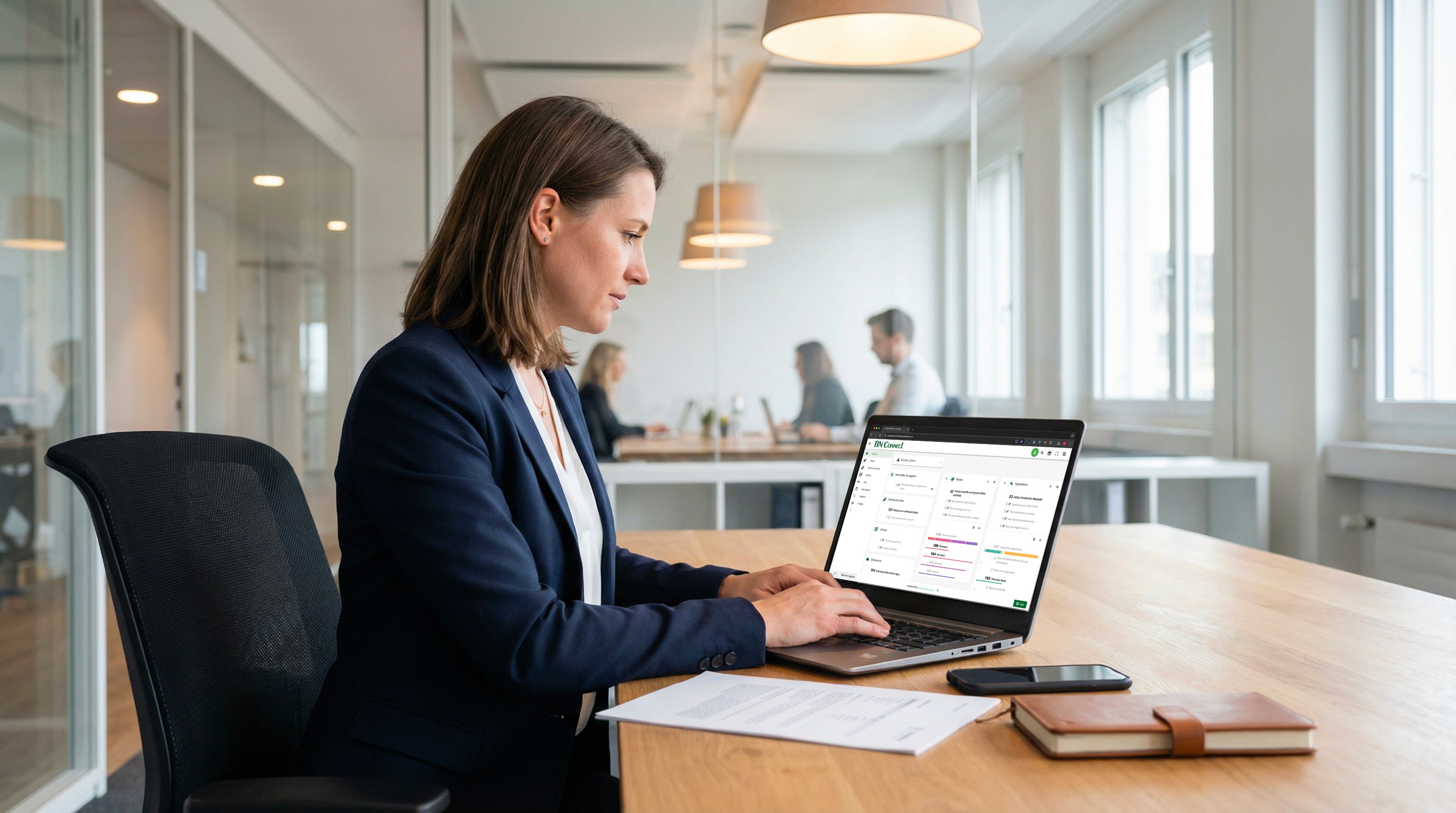 Professional using booking software on laptop
